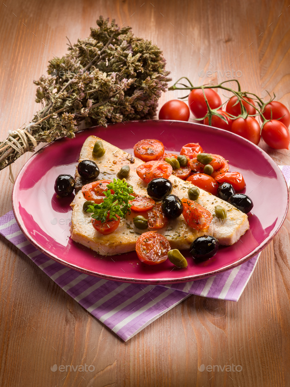 swordfish with tomatoes capers and olive,traditional sicily recipe Stock Photo by